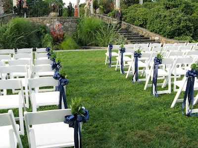 The aisle was lined with herbal clusters of rosemary and bay leaves tied