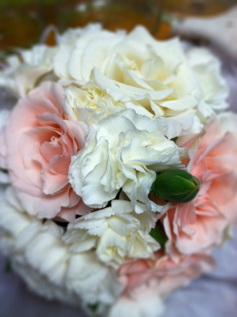 Pink white and green pomander and arch decor for the outside wedding 