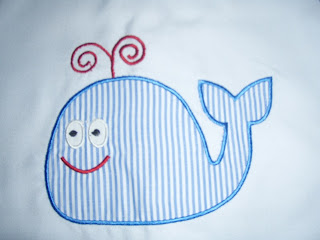 This whale applique design can be sewn on to baby clothes and is av