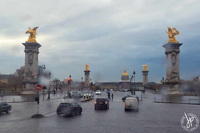 bridge, cars, golden ornate sculptures, building