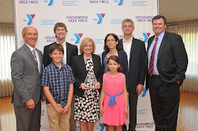 “CA Robbins Family, Ed Hurley, Brian Earley”:  The Robbins Family received the YMCA’s prestigious Chairman’s Award.  Pictured in the back row are (from left to right) Hockomock Area YMCA President Ed Hurley, Robbie Robbins, Terry Robbins, Donna Robbins, Jason Robbins and Hockomock Area YMCA Board of Directors Chairman Brian Earley.  James Robbins (left) and Mary Jane Robbins are in the front row