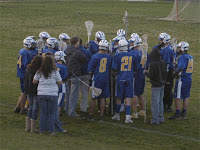 Coach Lamb instructs the Trojans