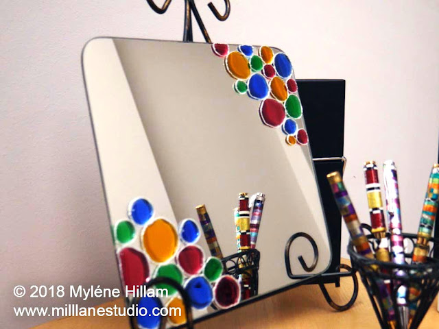 Resin jewelled mirror displayed with an assortment of Friendly Plastic mosaic pens