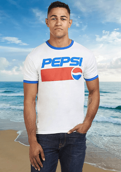 Man wearing a red, white and blue T-shirt with Pepsi logo at the beach