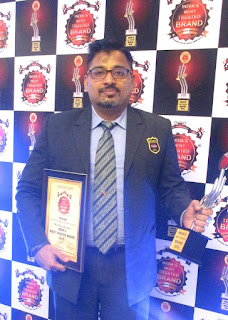 Mr. Ravi Nair, Country Head - HR, Topsgrup receiving award 1