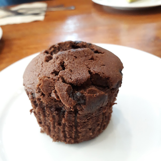 Choco muffin-  A small domed cake with chocolate chips on top.