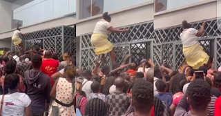 Many reacts as Woman shows her spider-woman style to gain entry into banking hall [Video]