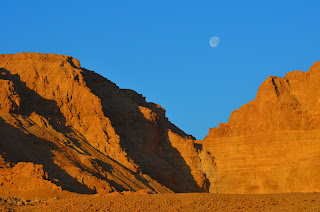 rocky cliffs and moon near dead sea israel