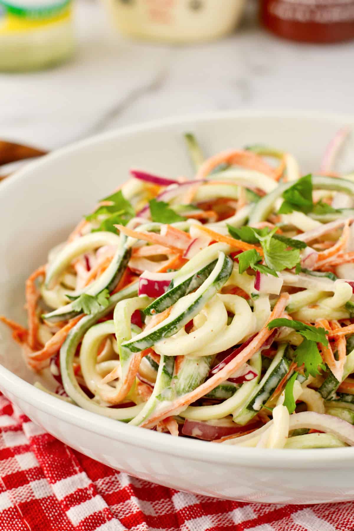 Zucchini Slaw close up in a serving bowl.