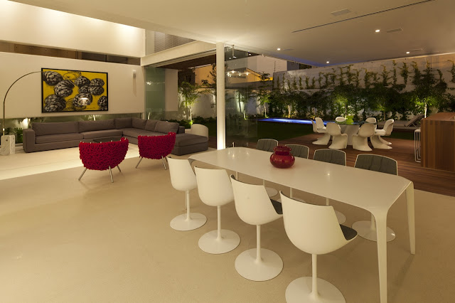 Modern dining room of FF House in Mexico at night