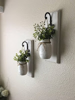 Floreros para decorar el hogar hechos con frascos de vidrio reutilizados