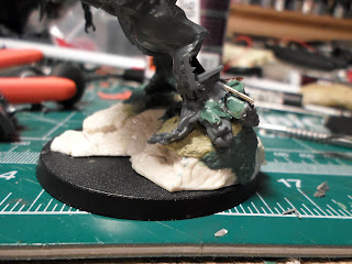 the base of the HelBrute showing the built up rock face with green stuff.