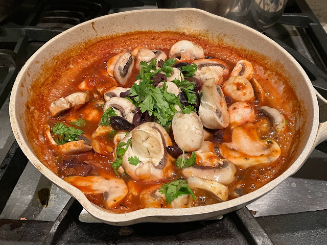 skillet with marinara sauce, mushroom, and olives, vegan