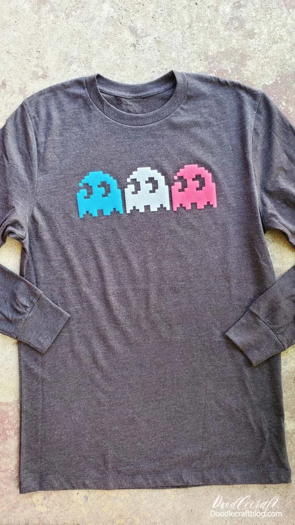 Say hello to WALAKut Glow Puff HTV!   It's the best heat transfer vinyl!   It adheres at a low temperature in just seconds.    It has a cool "puffed up" textures.   And, this fabulous HTV glows in the dark.   They come in a variety of colors and effects--I picked three for this shirt and it used barely any of my sheet of HTV, so there's more projects coming!