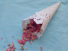Looking to make your own DIY confetti cones?  Here is a great tutorial for cute, cheap and easy doily confetti cones!