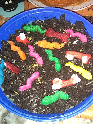 Dirt pudding made out of crush Oreo's, vanilla pudding and gummy worms.