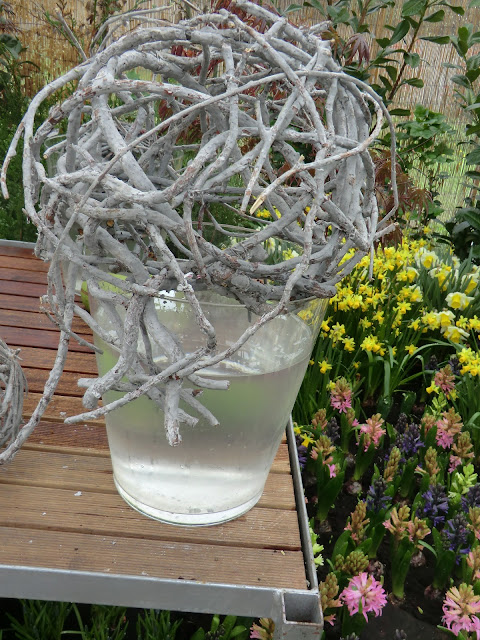 twig ball over vase in floral display, the Camellia 