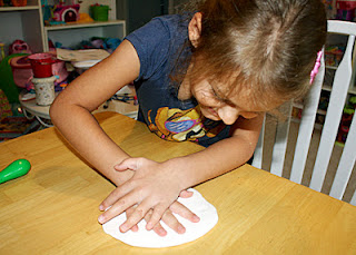 Tessa pressed her hand into Crayola Model Magic to create a "fossil." 