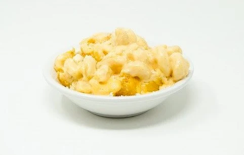 Creamy macaroni cheese in a white bowl