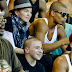 Finally... a smile! Madonna's stony face cracks as she's moved by a social music project in a Brazilian shanty town  