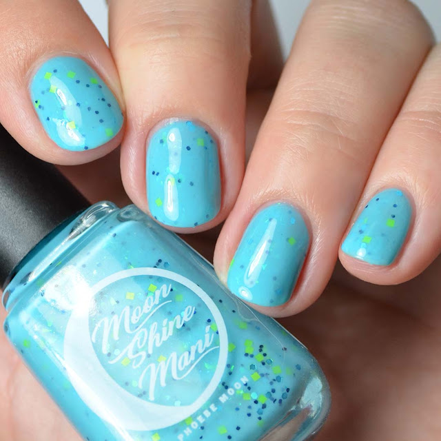 blue crelly nail polish with green glitter