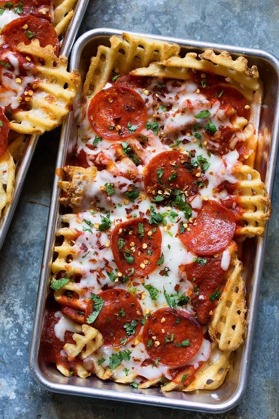 Pizza waffle fries recipe. This makes a delicious tasty homemade snack or an indulgent dinner for a date night in with your boyfriend, girlfriend, or best friend. It's like nachos, just WAY better.