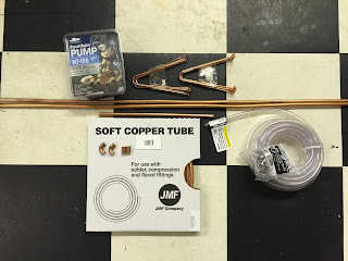 cheap pond pump, 3/8"OD soft copper tubing, 90° elbows, copper pipe hangers, 3/8"OD vinyl tubing, hose clamps