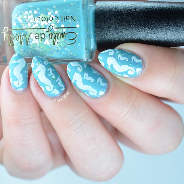 light blue nail polish with seahorse stamping