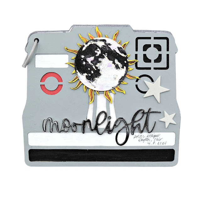 Document the memories of the stunning beauty of a solar eclipse in a polaroid inspired chipboard mini album with a moon covered sun embellishment.