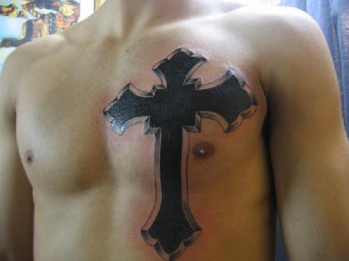 cross tattoos with wings on back. He got a cross tattooed below