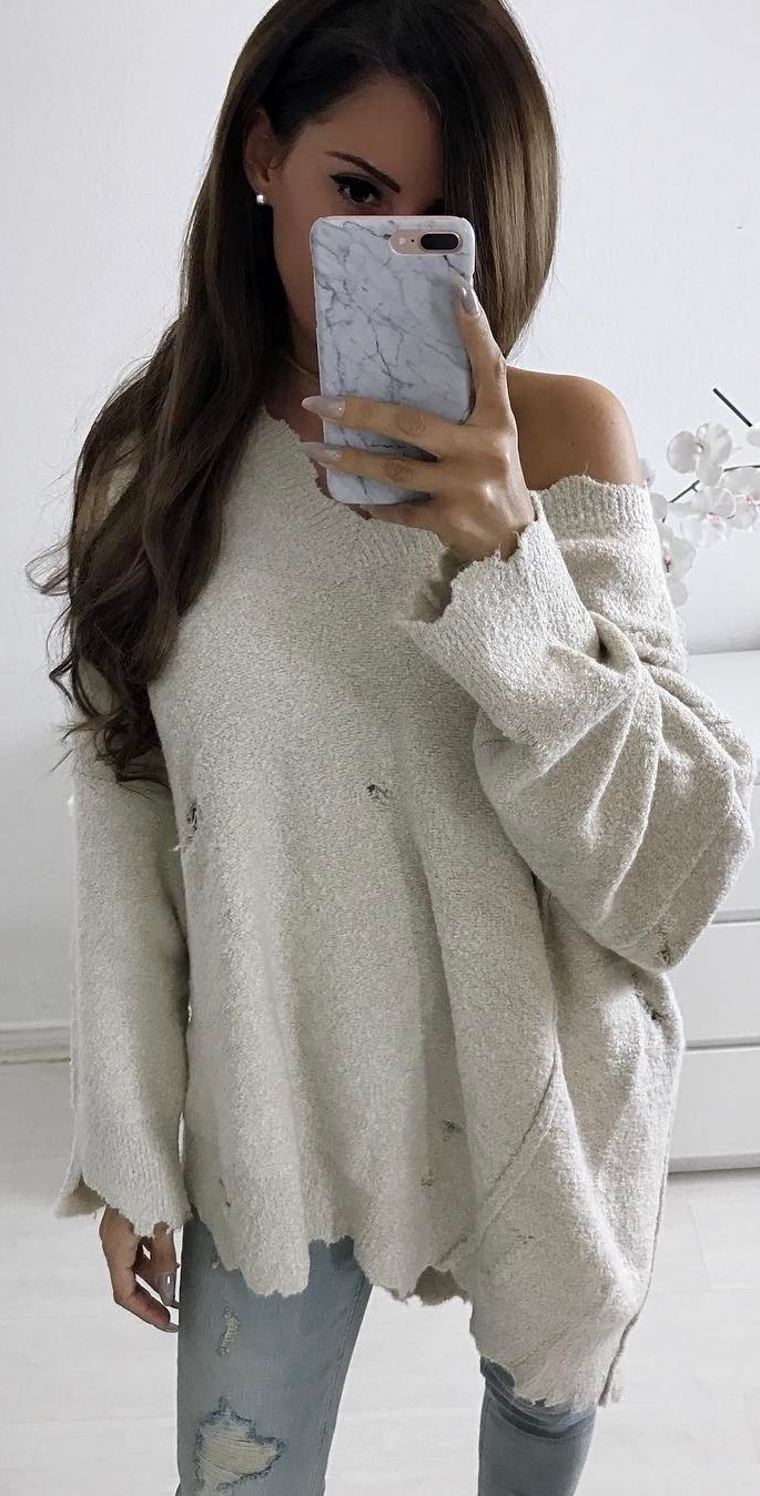 one shoulder sweater and jeans