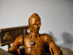 figura en miniatura del robot de la guerra de las galaxias c-3po