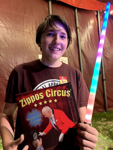 Teenager wirth Zippos Circus programme and lightsaber