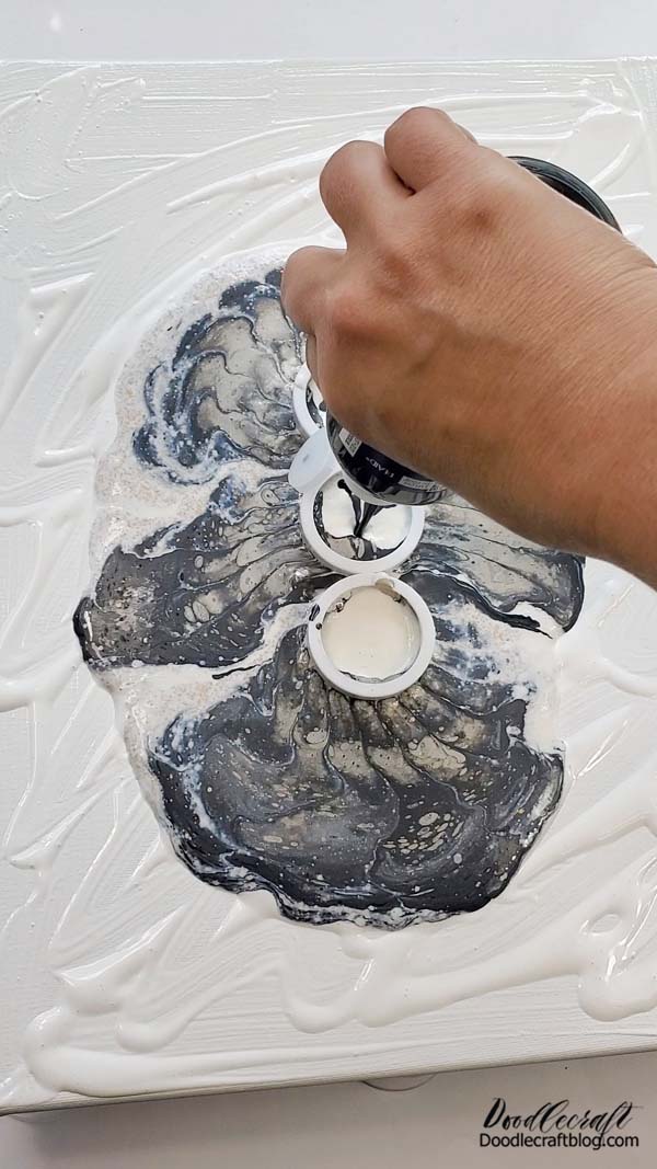 See how the paint makes such a natural and swirly combination just by flowing through the strainer?