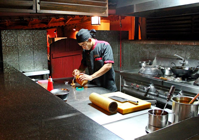 cook working in modern kitchen