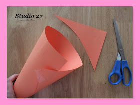 Trimming the construction paper cone template