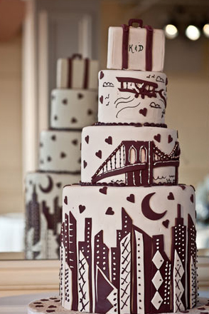 A gorgeous Art Deco wedding cake decorated with the Manhattan skyline