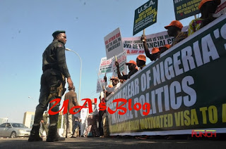 PHOTOS: Group protests at American embassy in Abuja