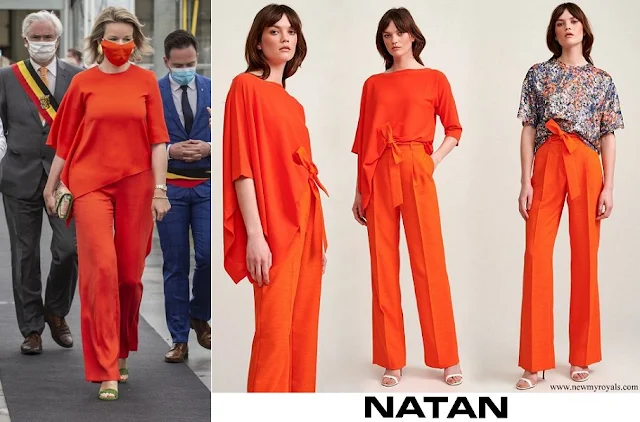 Queen Mathilde wore Natan Adria orange asymmetric jumper and Milan trousers