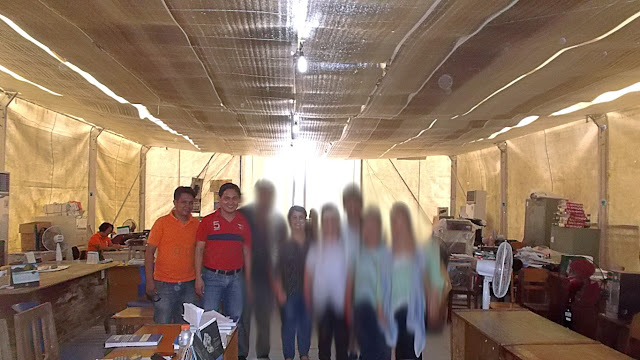 Mayor Sheen Gonzales posing with visitors inside the tent temporary municipal hall of Guiuan Eastern Samar