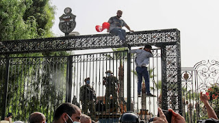 Picture of troops outside the very beautiful gate of the Parliament building in Tunisia