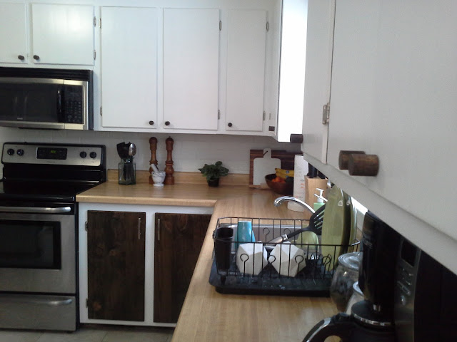 kitchen cabinet makeover reveal white and wood stained wooden knobs