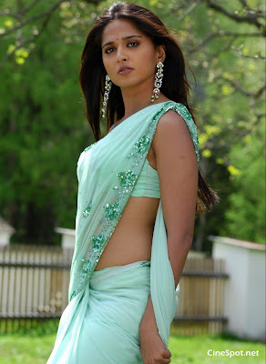 Anuskha Shetty look gorgeous in lemon colored saree, reveling her figure just as much as required.