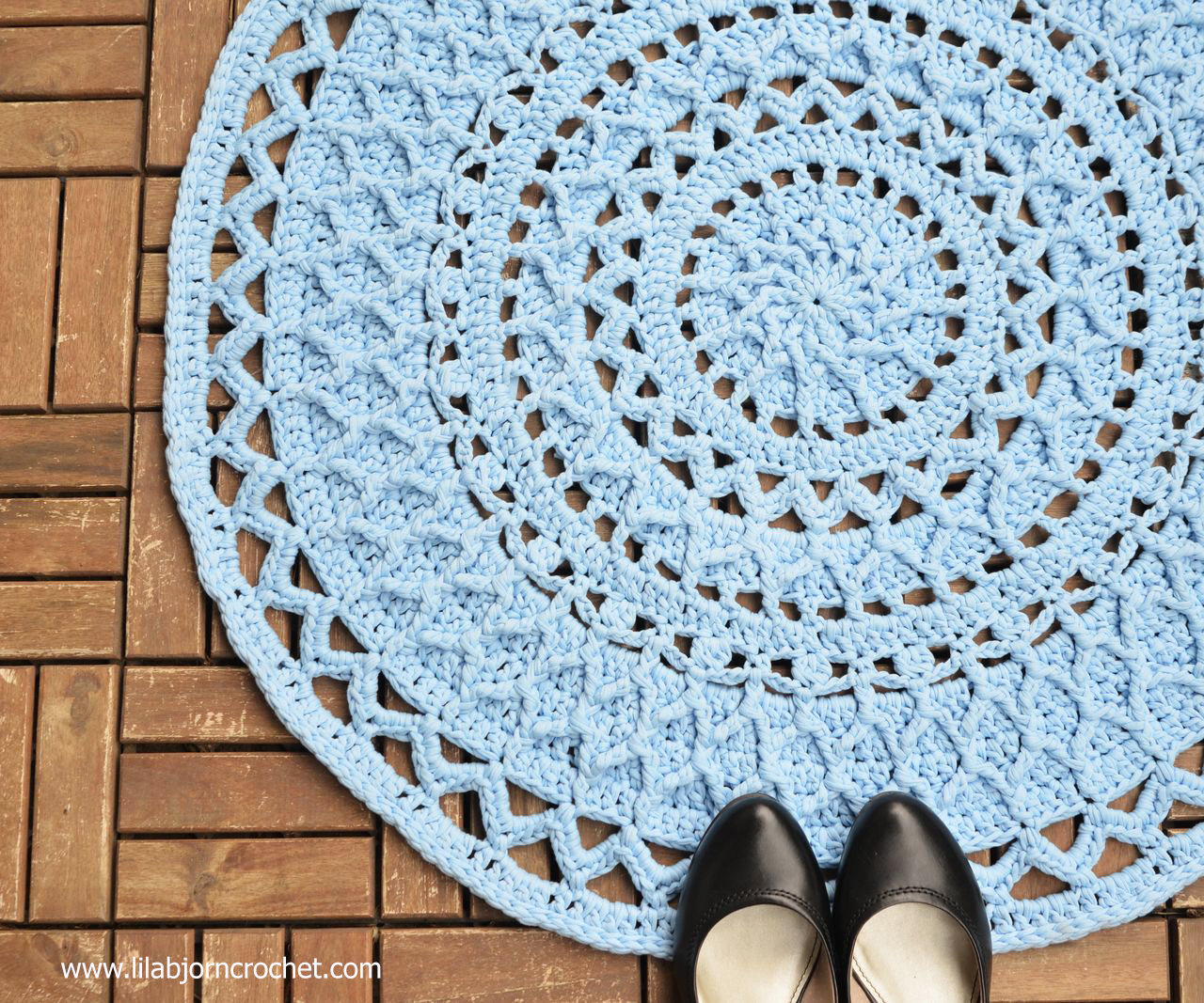 Andromeda Mandala Rug combines textured stitches with open, lace parts. The pattern can also be used for a doily when lighter yarns and small hook are used. Original design by Lilla Bjorn Crochet.