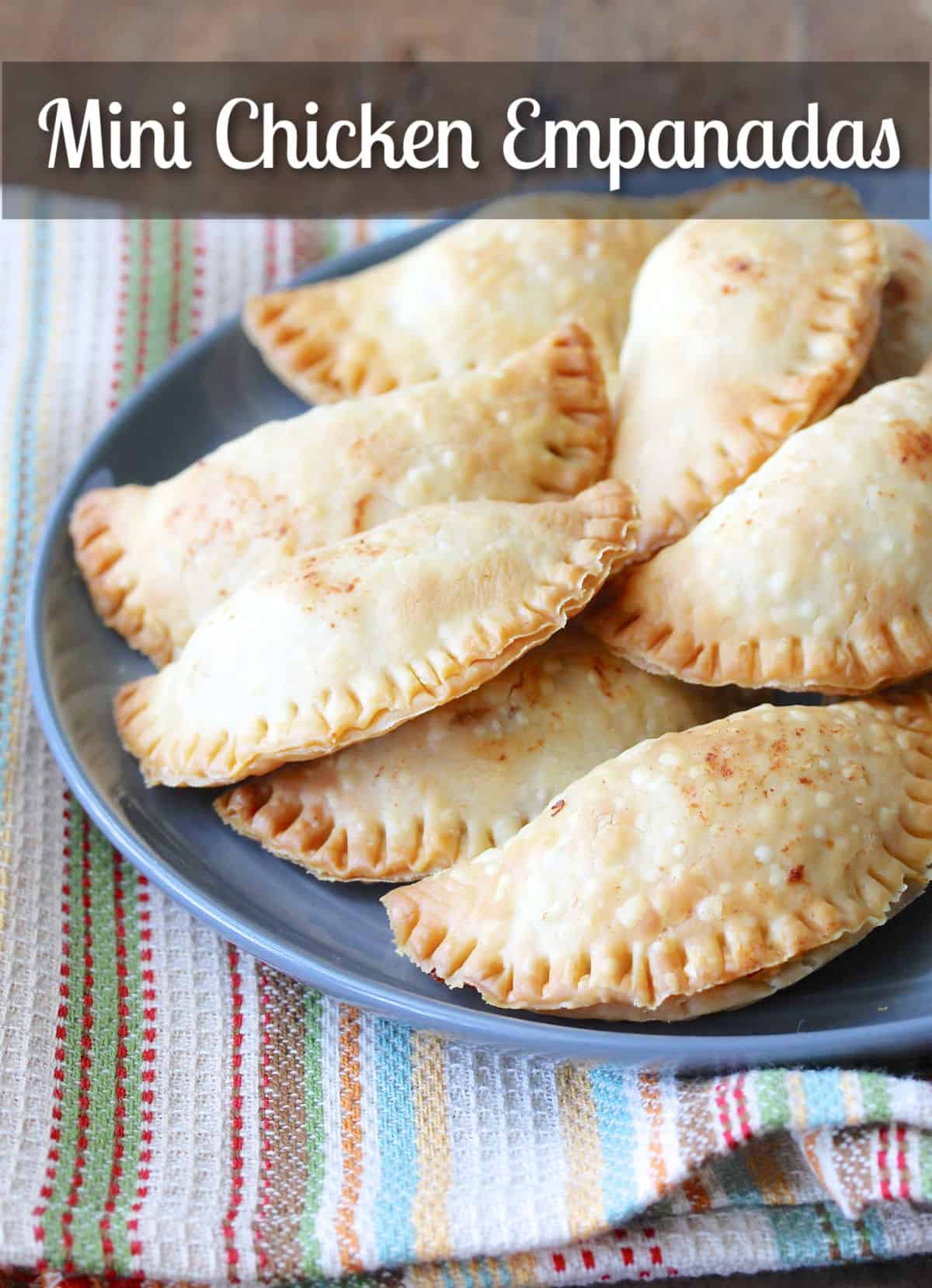 Mini Chicken Empanadas with Cheese and Chiles on a blue plate.