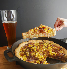 Deep Dish Cornmeal Pizza topped with Smoked Mozzarella, Chicken Sausage, Corn and Balsamic Caramelized Onions