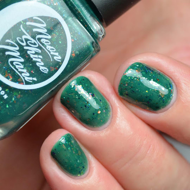 green nail polish with flakies swatch