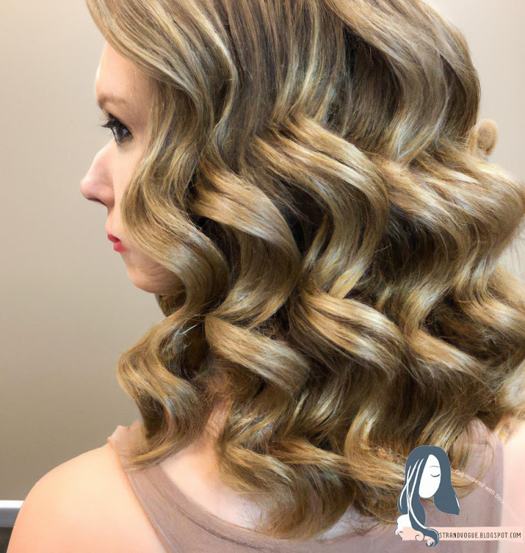 Braided Updo: This hairstyle features a French braid that is twisted into a bun at the nape of the neck. It's an elegant and sophisticated look that's perfect for a formal occasion.