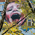 Graffiti murals >> yellow baby graffiti wall