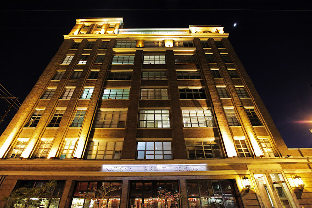 Photo of building at night as seen from the street